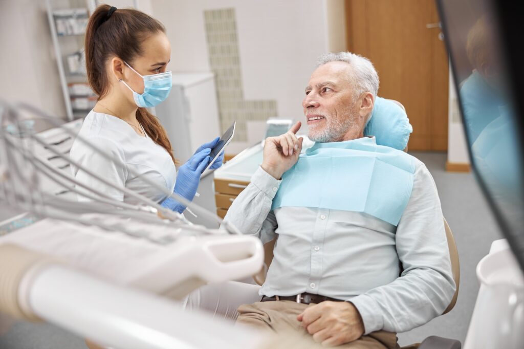 Competent dental expert giving a dental consultation